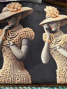 Elegant Double Femme Print Clutch - Black with Gold coloring.